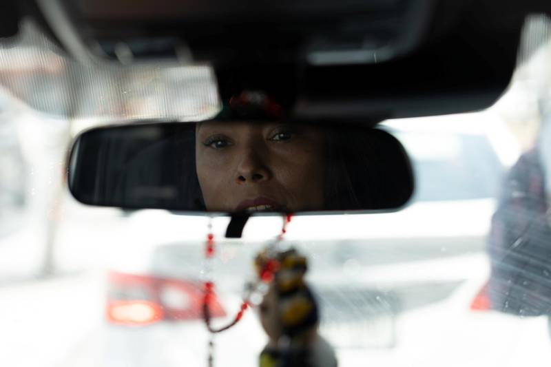 Felicia Rangel-Samponaro looks in the rearview mirror while driving in Matamoros, Mexico. The National / Willy Lowry