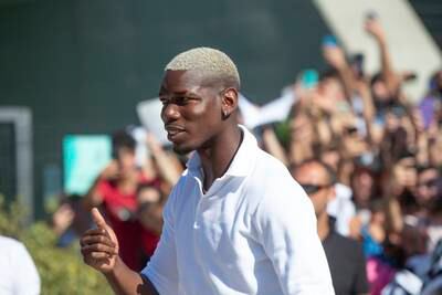 Paul Pogba gives the thumbs up as he arrives at the J Medical Centre in Turin. AP