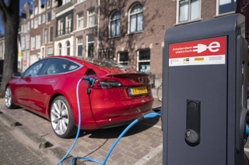A Tesla Inc. Model 3 electric automobile recharges at a charging station in Amsterdam, Netherlands, on Monday, April 1, 2019. With 5,315 new cars registered, Tesla’s Model 3 accounted for 29 percent of the new sales. Photographer: Jasper Juinen/Bloomberg