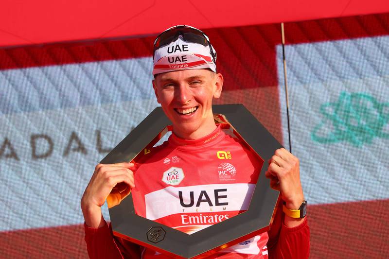UAE Team Emirates' Slovenian cyclist Tadej Pogacar celebrates on the podium after winning the United Arab Emirates cycling tour, from Al Jahili Fort to Jebel Hafeet, on February 26, 2022.  (Photo by Giuseppe CACACE  /  AFP)