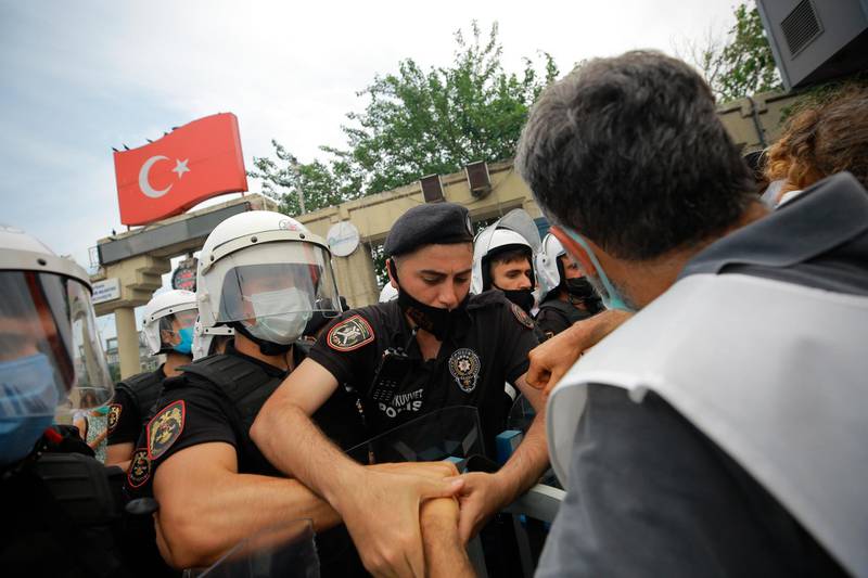 Protestors opposing President Recep Tayyip Erdogan's Istanbul Canal project scuffle with Turkish police officers on June 26, 2021. AP Photo