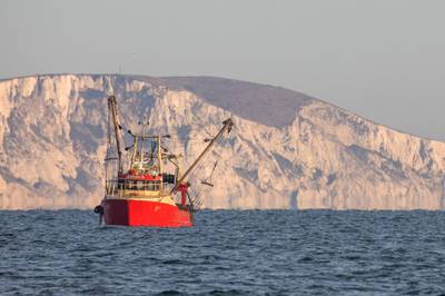 Fishing boat 'Jennah D' motors past Beachy Head cliffs while trawling in the English Channel from the Port of Newhaven, East Sussex, U.K. on Sunday, Jan. 10, 2021. While Prime Minister Boris Johnson claimed last month’s trade deal will let the U.K. regain control of its fishing waters by taking back 25% of the European Union’s rights over five years, many fishermen feel let down. Photographer: Jason Alden/Bloomberg