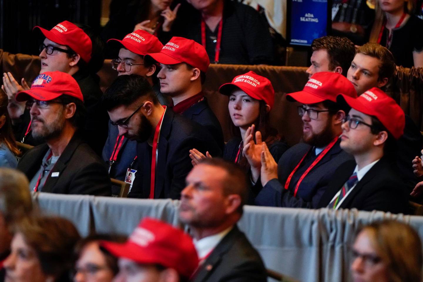 People wearing MAGA hats listen as U.S. Vice President Mike Pence speaks at the Conservative Political Action Conference (CPAC) annual meeting at National Harbor in Oxon Hill, Maryland, U.S., February 27, 2020.      REUTERS/Joshua Roberts