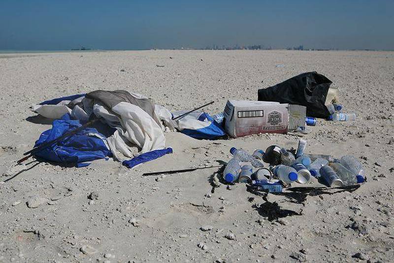 Trash is left behind by visitors of the man made island next to Bahraini Island.