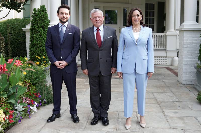 Jordanian King Abdullah II (C) accompanied by Crown Prince Hussein bin Abdullah (L) and US Vice President Kamala Harris at the Vice President's residence at the  Naval Observatory in Washington.
