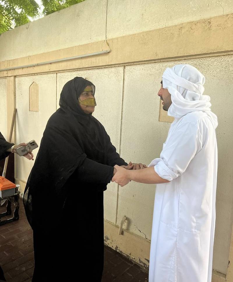 The Fujairah royal family member greets a resident.

