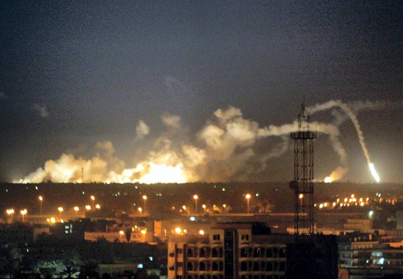 Explosions rock Baghdad late 29 March 2003 during a coalition raid on the Iraqi capital. It was not immediately clear what targets had been hit in the bombing on the soutern rim of the city but Iraqi satellite television broadcasting outside the country was interrupted.       AFP PHOTO/Patrick BAZ (Photo by PATRICK BAZ / AFP)