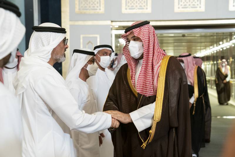 Prince Mohammed greets Sheikh Khaled bin Mohamed.