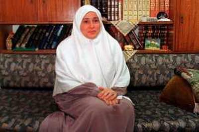 Egyptian Jihan al-Halafani (48), poses in her Alexandria home 21 August 2000. Al-Halafani, a member of Egypt's outlawed Muslim Brotherhood is to run for parliament for the first time this year. The 80 Brotherhood members vying for parliament in the elections due later this year, will run as independents as the movement has no legal existence.