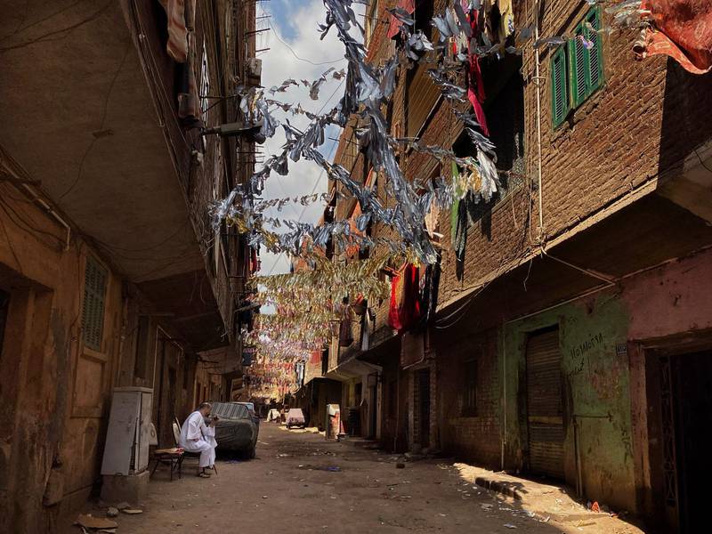 Ramadan decorations hang on a street that is on complete lockdown after a family was tested positive due to coronavirus in Bahtim, Shubra El Kheima neighbourhood of Qalyoubiya governorate. AP