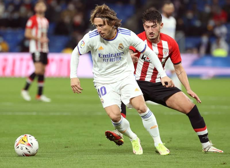 Real Madrid midfielder Luka Modric takes the ball away from Athletic  midfielder Unai Vencedor. EPA
