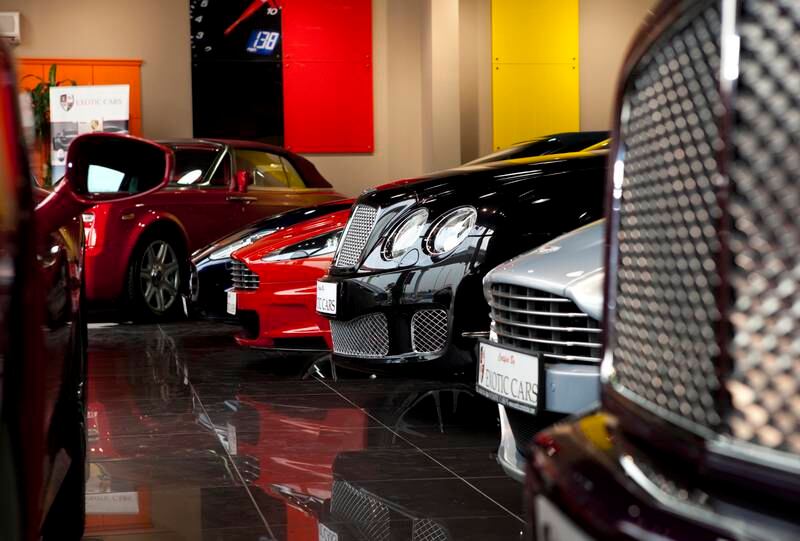 Dubai, United Arab Emirates - January 10 2012 - Rolls Royces, Bentleys, Maseratis, Ferraris and other high end cars sit at the Exotic Cars Showroom off Sheikh Zayed Road. The company was recently featured on Channel 4's "Billionaire Boy Racers" . (Razan Alzayani / The National)  