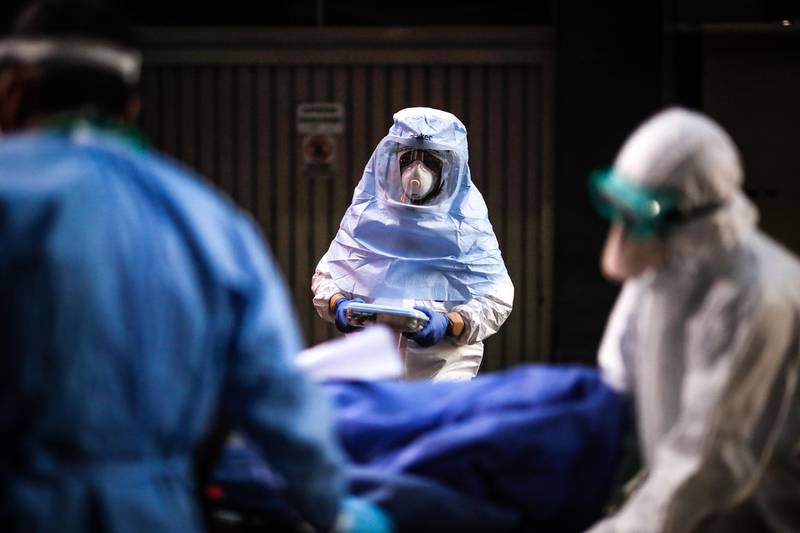 Medical personnel carry out the transfer of residents from a nursing home who tested positive for the COVID-19 in Buenos Aires, Argentina. EPA