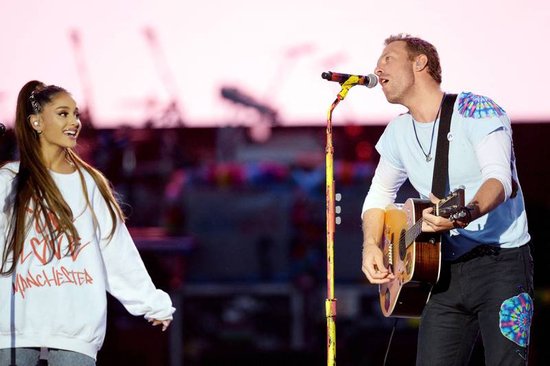 Coldplay's Chris Martin, right, and Ariana Grande perform at the One Love Manchester benefit concert for the families of the victims of the May 22 Manchester Arena bombing, at Emirates Old Trafford in Greater Manchester, in 2017. AFP