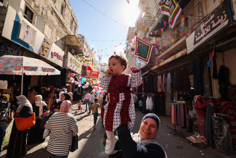 Palestinians in the West Bank city of Nablus celebrate the anniversary of the Prophet Mohammed's birth. All photos: AFP