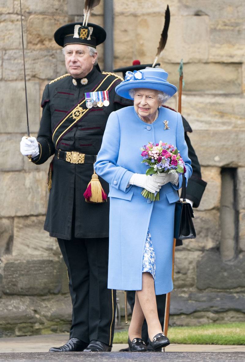 Queen Elizabeth II, in blue, attends the Ceremony of the Keys on the forecourt of the Palace of Holyroodhouse in Edinburgh. Getty Images