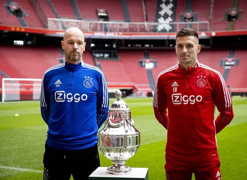 Ajax head coach Erik ten Hag and his player Dusan Tadic pose with the KNVB Cup during a press conference at Johan Cruijff ArenA in Amsterdam, the Netherlands, 15 April 2022. EPA