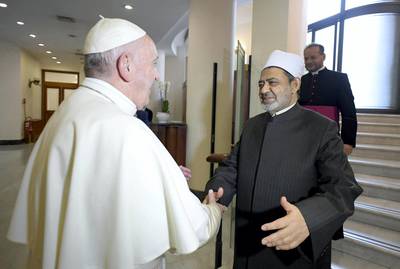 This handout photo taken on October 16, 2018 and released by the Vatican press office, the Vatican Media, shows Pope Francis greeting the Grand Imam of the al-Azhar, Sheikh Ahmed al-Tayeb at the Vatican. (Photo by HO / VATICAN MEDIA / AFP)