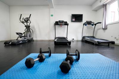 The gym, equipped with treadmills, weights, rowing machines and exercise bikes