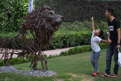 A scrap iron sculpture of a lion, the national animal of Great Britain is displayed at a park in New Delhi ahead of the G20 India summit. AFP