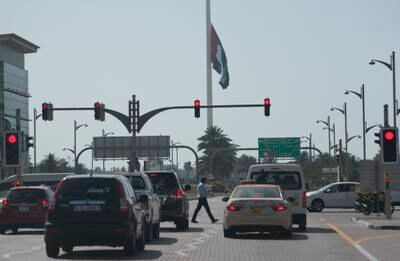 The UAE national flag flies at half-staff in Dubai. AP Photo