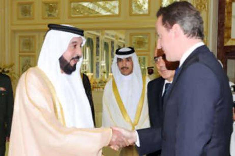 Shiekh Khalifa bin Zayed, President of the UAE and Ruler of Abu Dhabi, left, greets the newly elected British prime minister David Cameron yesterday.