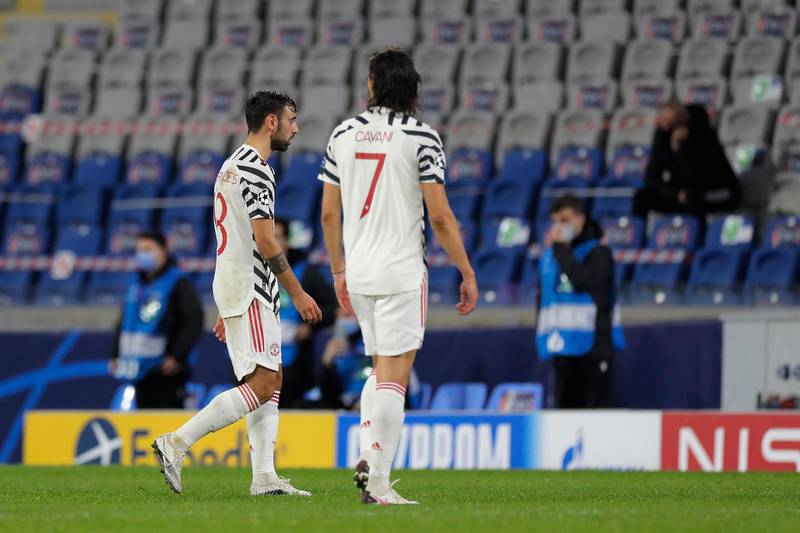 Manchester United's Bruno Fernandes, left, and Manchester United's Edinson Cavani walk in dejection at the end of the game. AP