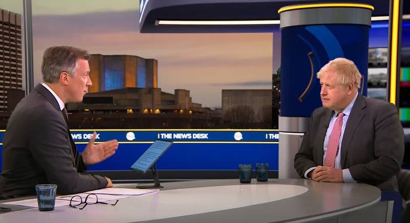 British Prime Minister Boris Johnson, right, is interviewed by Tom Newton Dunn on TalkTV. PA