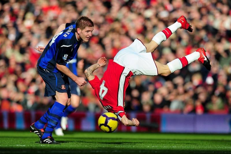 Cesc Fabregas is upended during a game between Arsenal and Sunderland. 20/09/2010. Mike Hewitt / FPA / LDY Agency