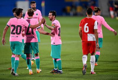 Lionel Messi celebrates with teammates after scoring Barca's third goal. Getty