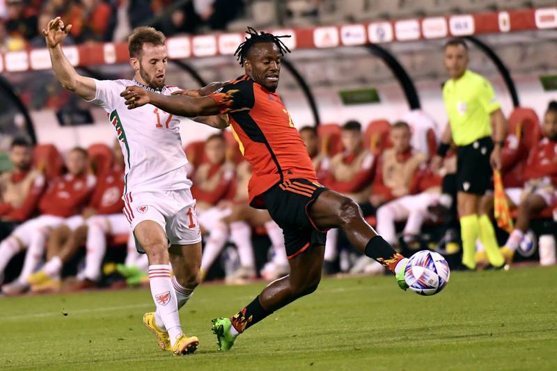 Belgium's Michy Batshuayi, right, fights for the ball against Wales' Rhys Norrington-Davies. AP