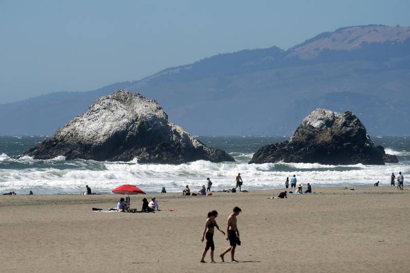 People visit Ocean Beach during the coronavirus outbreak in San Francisco. AP Photo