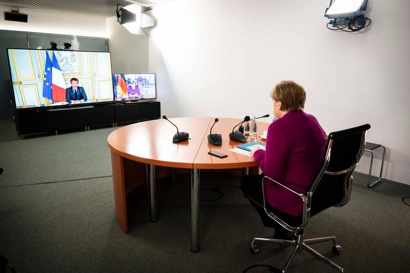 TOPSHOT - This Handout photo made available by the German government's press office shows German Chancellor Angela Merkel speaking with French President Emmanuel Macron, via video link, at the Chancellery in Berlin, Germany, on May 18, 2020 on the effects of the novel coronavirus COVID-19 pandemic.  - RESTRICTED TO EDITORIAL USE - MANDATORY CREDIT "AFP PHOTO /  BUNDESREGIERUNG / SANDRA STEINS
" - NO MARKETING - NO ADVERTISING CAMPAIGNS - DISTRIBUTED AS A SERVICE TO CLIENTS  - NO ARCHIVES

 / AFP / Bundesregierung / Bundesregierung / Sandra Steins / RESTRICTED TO EDITORIAL USE - MANDATORY CREDIT "AFP PHOTO /  BUNDESREGIERUNG / SANDRA STEINS
" - NO MARKETING - NO ADVERTISING CAMPAIGNS - DISTRIBUTED AS A SERVICE TO CLIENTS  - NO ARCHIVES


