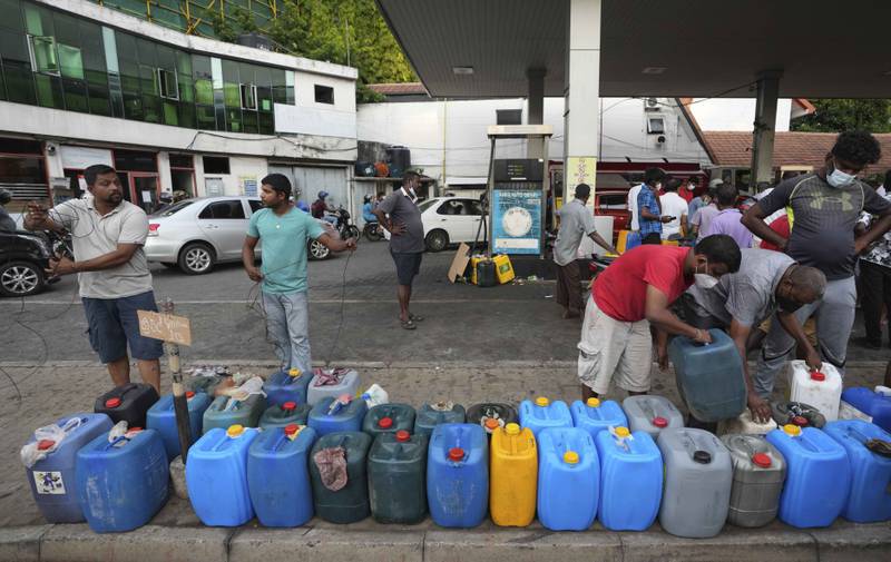 Sri Lankans flock to a fuel station to buy diesel. AP