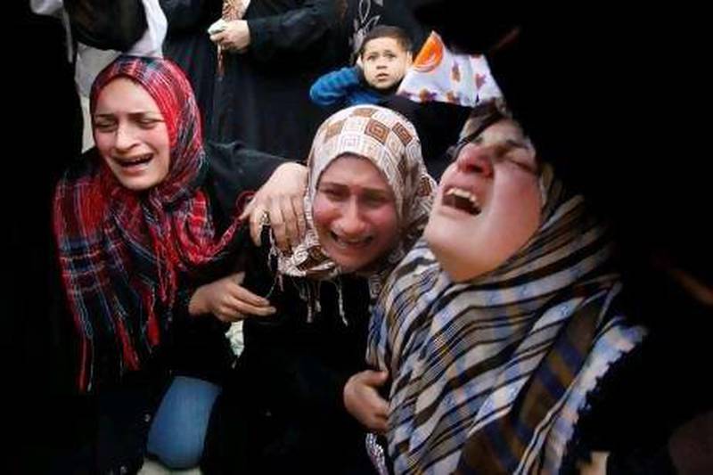 Palestinian women react during the funeral of Ayoub Assaleya, 12, who was killed in an Israeli air strike Sunday.