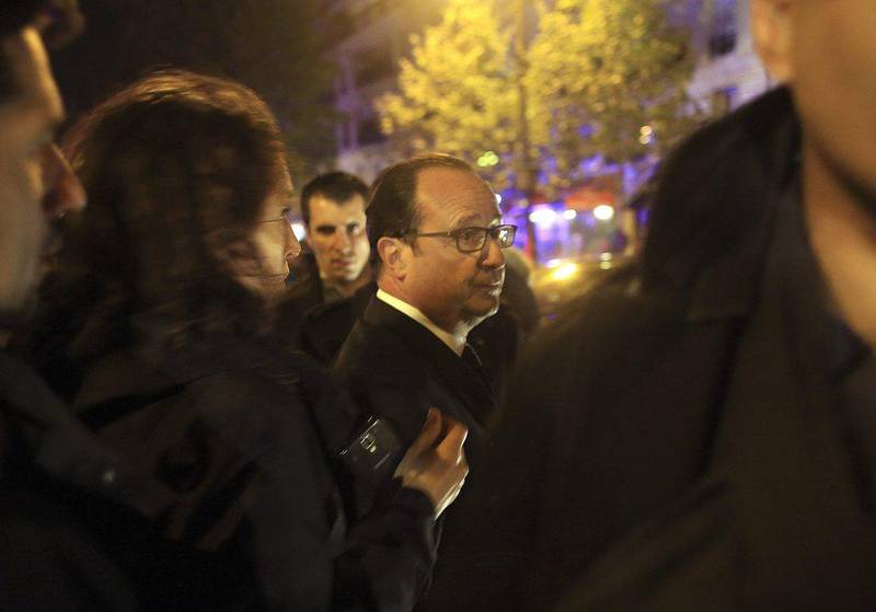 French president Francois Hollande, who declared a state of emergency and announced that he was closing the country's borders, arrives to visit the site of the the Bataclan theatre after the maasacre. Thibault Camus/AP Photo
