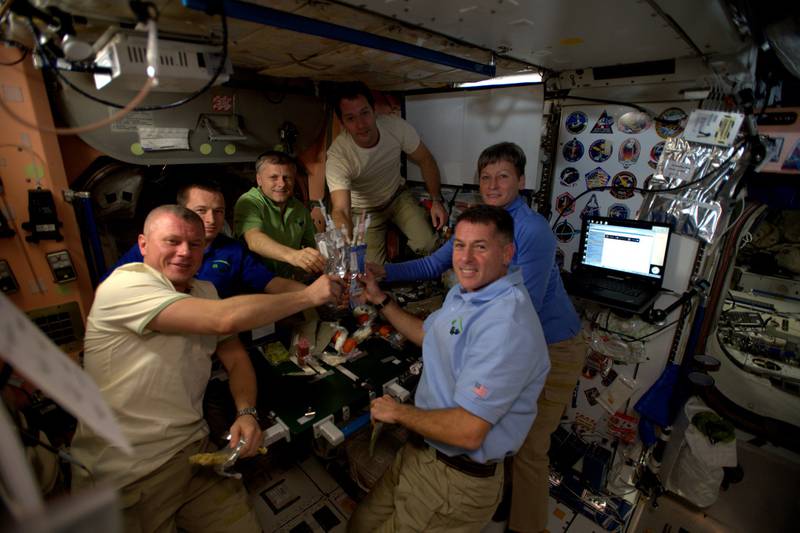 Expedition 50 crew members celebrate Thanksgiving in space in November 2016, with rehydrated food