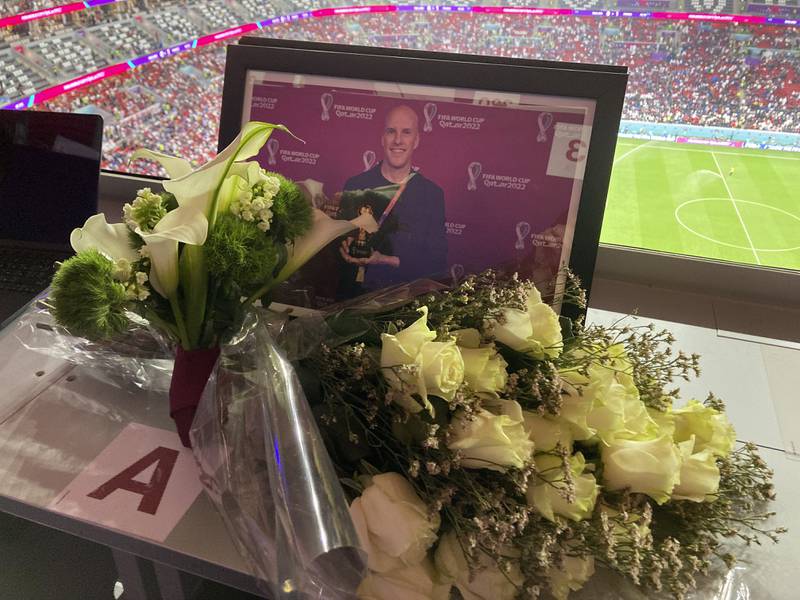 A tribute to journalist Grant Wahl is seen on his previously assigned seat at the World Cup quarterfinal soccer match between England and France, at the Al Bayt Stadium in Al Khor, Qatar, Saturday, Dec.  10, 2022.  Wahl, one of the most well-known soccer writers in the United States, died early Saturday Dec.  10, 2022 while covering the World Cup match between Argentina and the Netherlands.  (AP Photo / Graham Dunbar)