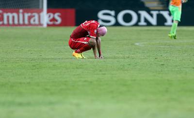 Mohammed Al Akber ponders defeat after UAE lose 2-1 to Honduras. Sammy Dallal / The National