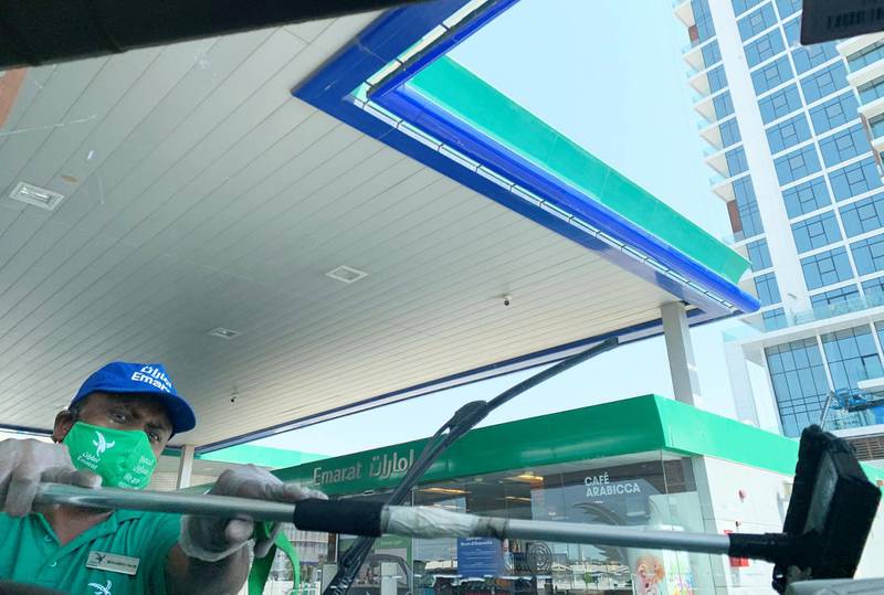 DUBAI, UNITED ARAB EMIRATES , October 10 – 2020 :- Attendant of Emarat gas station wearing protective face mask as a preventive measure against the spread of coronavirus in Dubai. (Pawan Singh / The National) For News/Stock/Online.