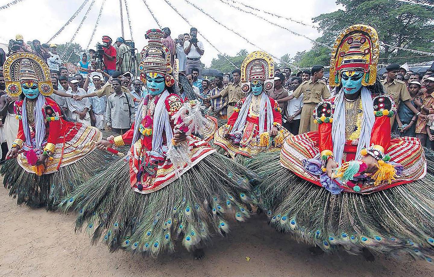 Artists perform a traditional dance during the start of the 10-day-long Onam festival in Kochi, in the southern Indian state of Kerala. AP
