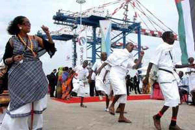 Djibouti men and women dance during the opening ceremony of Dubai-based port operator DP World's Doraleh container terminal in Djibouti port, Saturday, Feb. 7, 2009. (AP Photo/Adam Schreck) *** Local Caption ***  XKJ505_Dubai_Port_Empire.jpg *** Local Caption ***  XKJ505_Dubai_Port_Empire.jpg