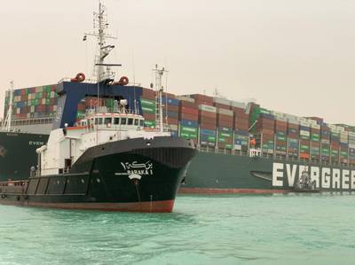CORRECTION / A handout picture released by the Suez Canal Authority on March 24, 2021 shows the Taiwan-owned MV Ever Given (Evergreen), a 400-metre- (1,300-foot-)long and 59-metre wide vessel, lodged sideways and impeding all traffic across the waterway of Egypt's Suez Canal. A giant container ship ran aground in the Suez Canal after a gust of wind blew it off course, the vessel's operator said on March 24, 2021, bringing marine traffic to a halt along one of the world's busiest trade routes.

 / AFP / Suez CANAL / - / == RESTRICTED TO EDITORIAL USE - MANDATORY CREDIT "AFP PHOTO / HO / Suez Canal" - NO MARKETING NO ADVERTISING CAMPAIGNS - DISTRIBUTED AS A SERVICE TO CLIENTS ==

