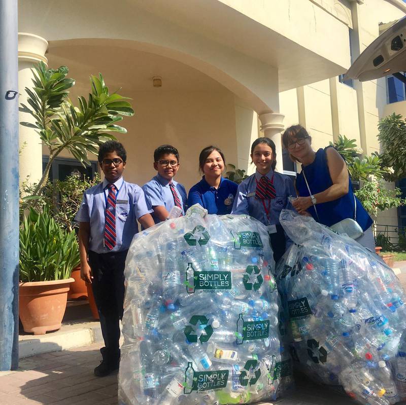 Pupils collect plastic bottles for recyling. Photo: Pristine Private School