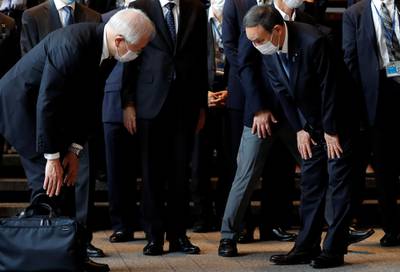 Japan's Chief Cabinet Secretary Yoshihide Suga bows as he is welcomed by officials, following the departure of outgoing Prime Minister Shinzo Abe, at the official prime minister's residence in Tokyo. REUTERS