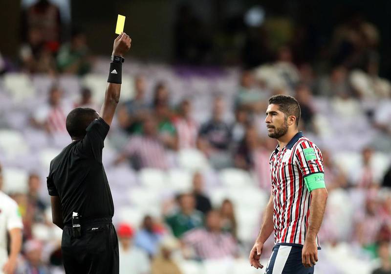 Guadalajara's Jair Pereira is shown a yellow card. Reuters