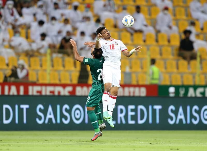 Abdalla Ramadan of the UAE fights for the ball with Iraq's Ahmed Fadhil. Chris Whiteoak / The National
