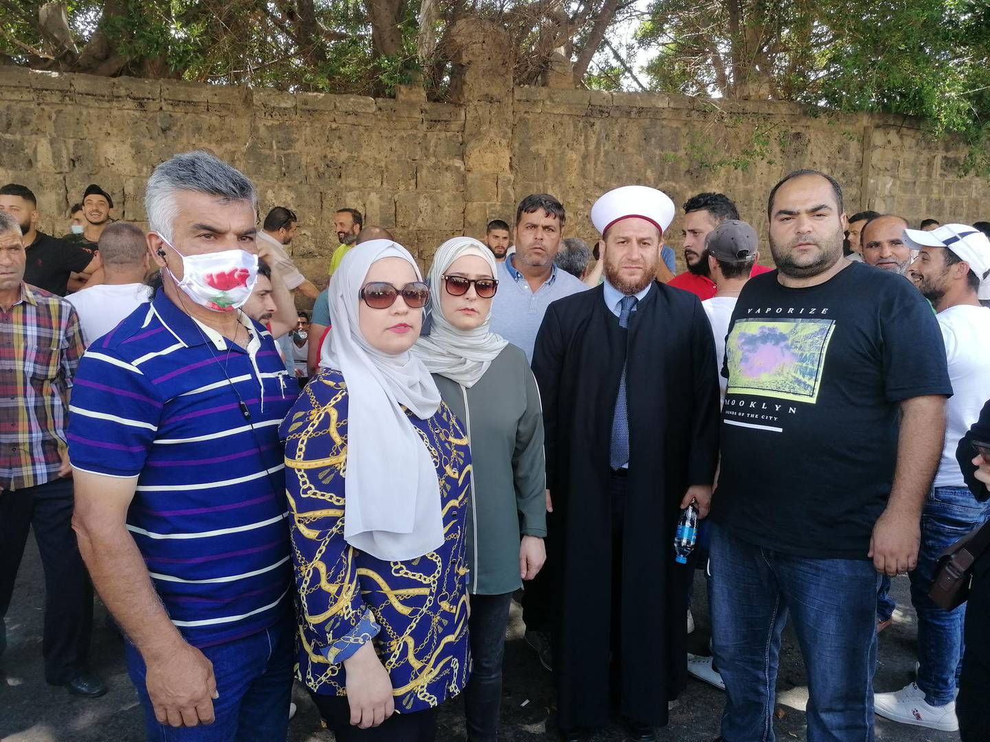 Kinda Al Khatib's sister Mariam Al Khatib (second from left) and brother Bandar (right) during a protest outside the Military Court in Beirut shortly after her arrest in June 2020. Sunniva Rose for The National