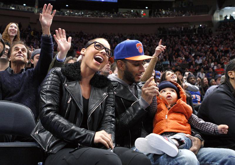 Keys with her husband Swizz Beatz and their son Egypt during the New York Knicks and Boston Celtics NBA basketball game in New York in 2011.