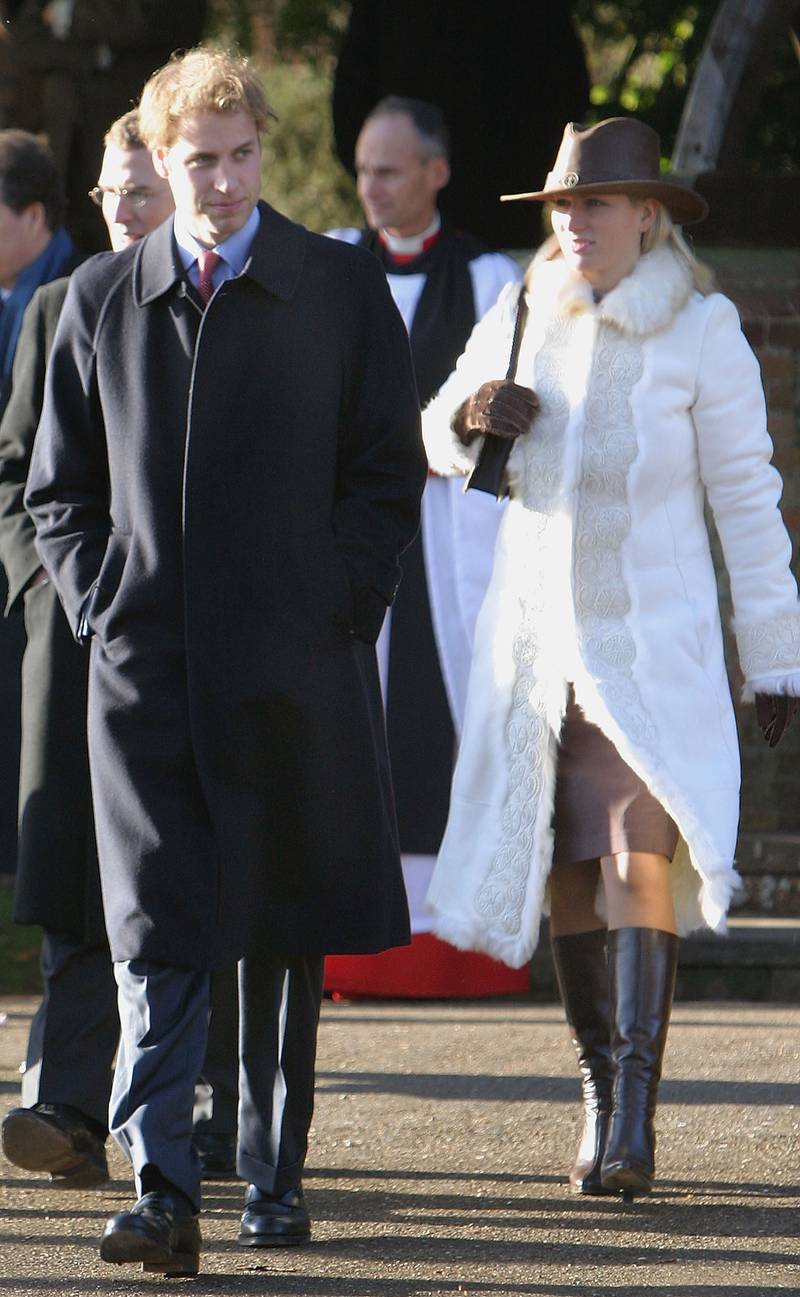 Prince William and Zara Phillips, wearing a white fur coat and a leather western hat, leave after attending the Christmas Day service at Sandringham Church on December 25, 2004. Getty Images